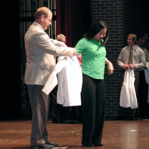 a modern white coat ceremony